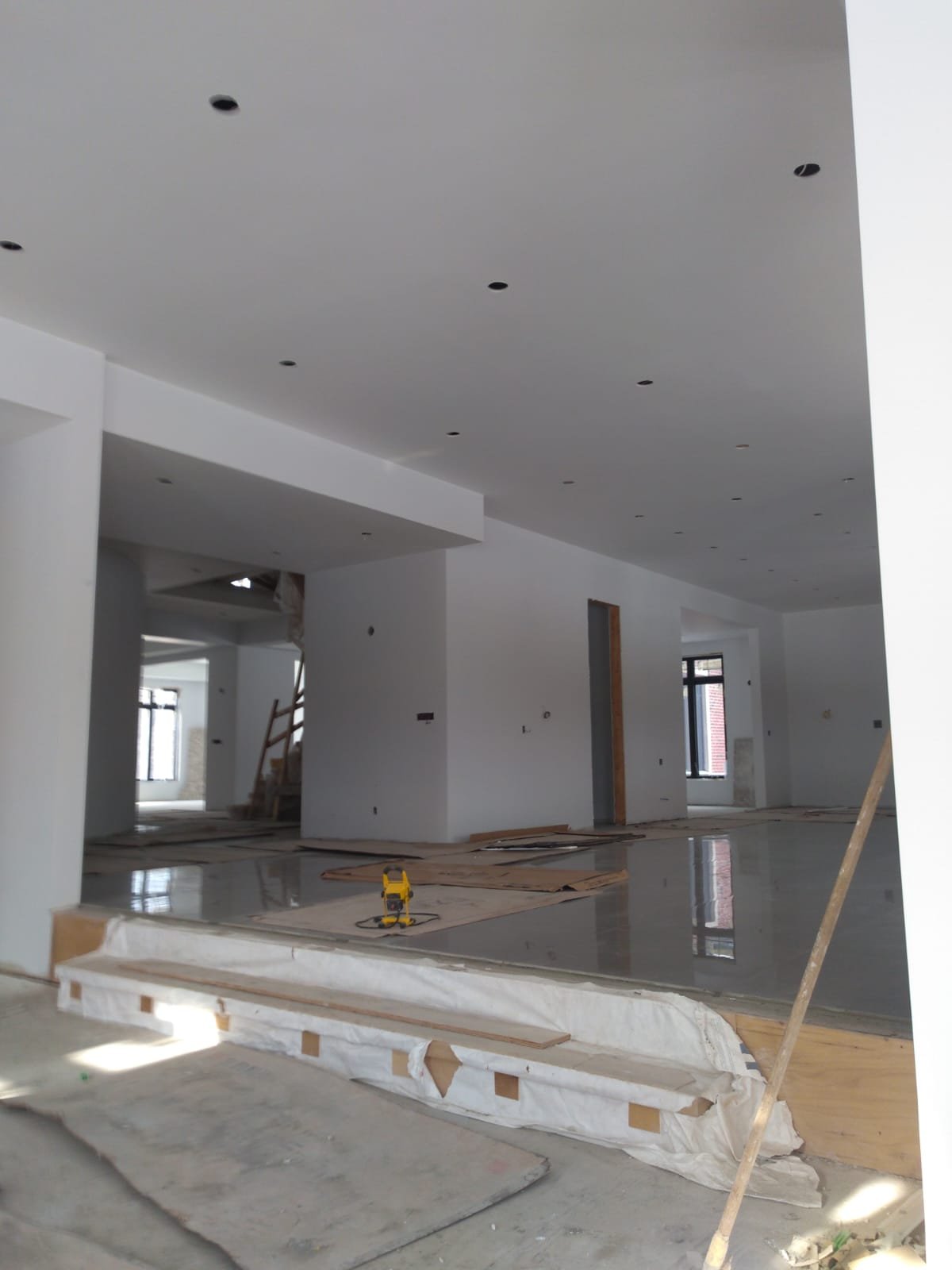 Open-concept interior at drywall stage during residential construction