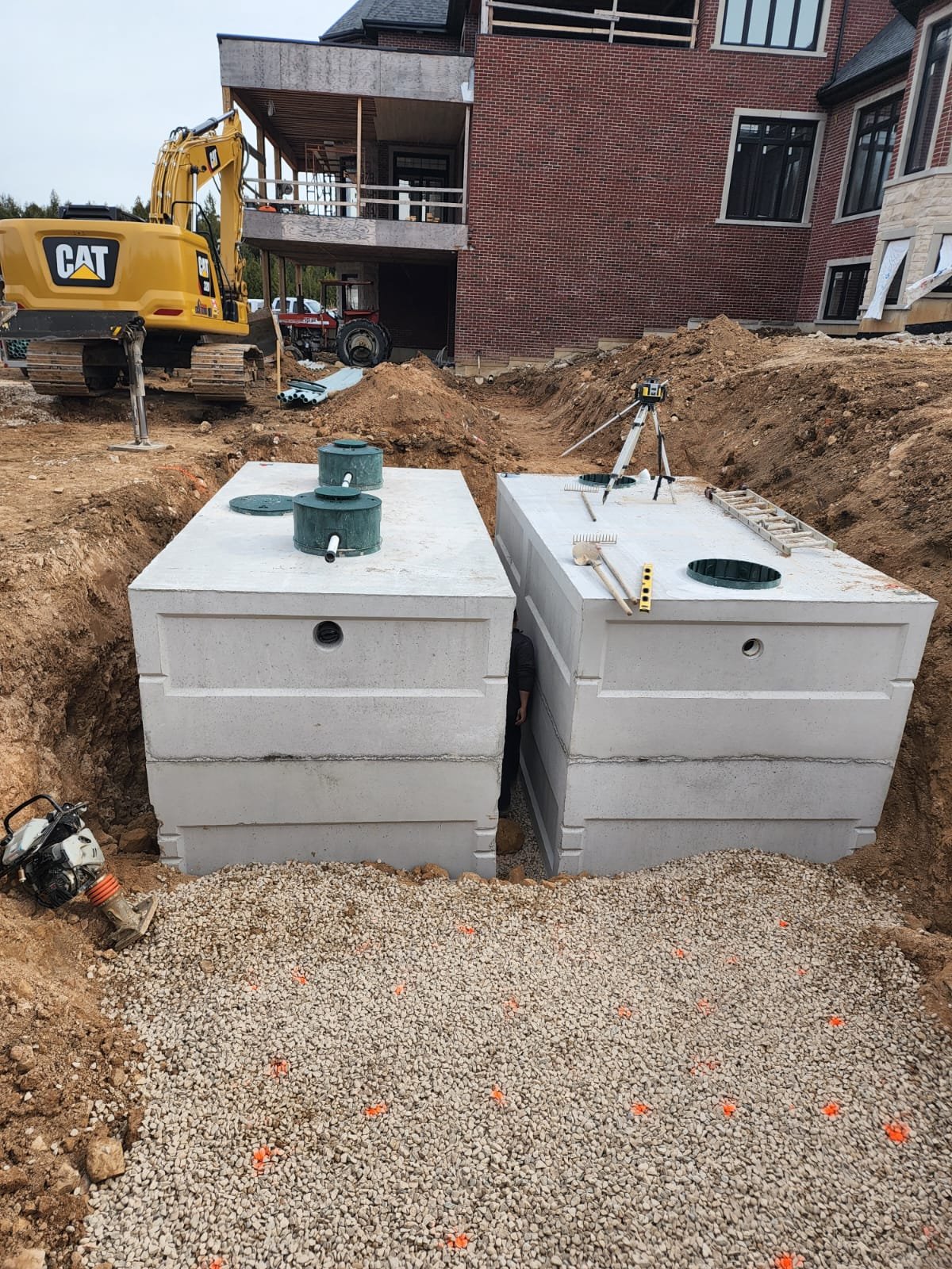 Residential site work showing septic installation in progress