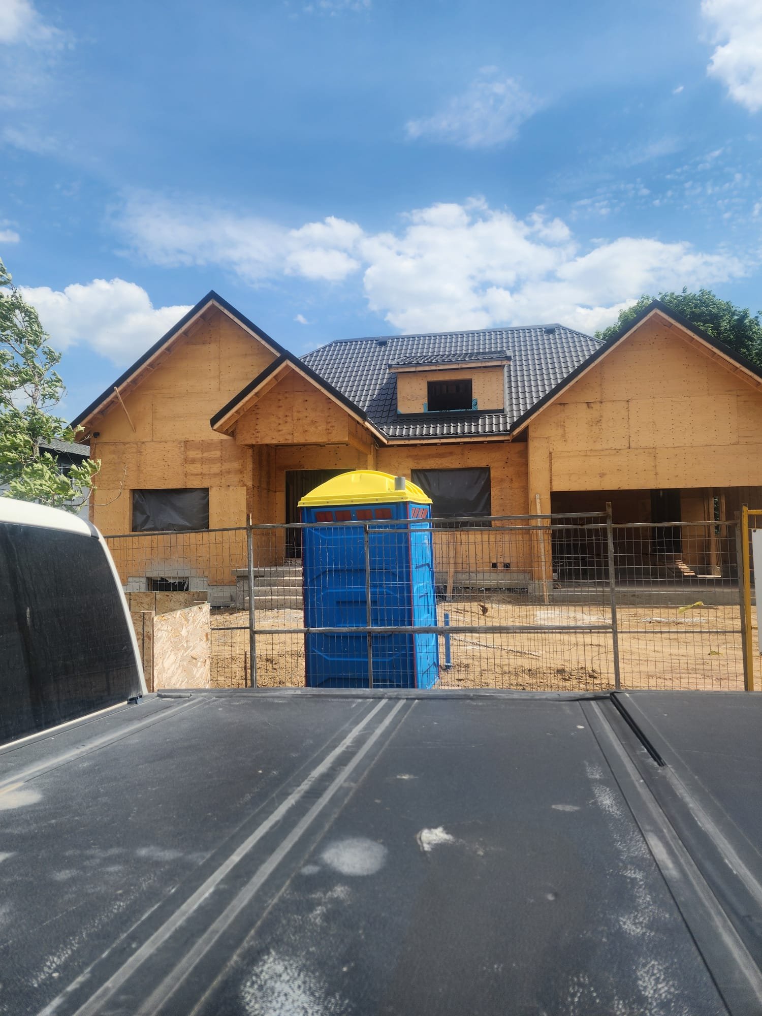 Timber-framed custom home shell under construction