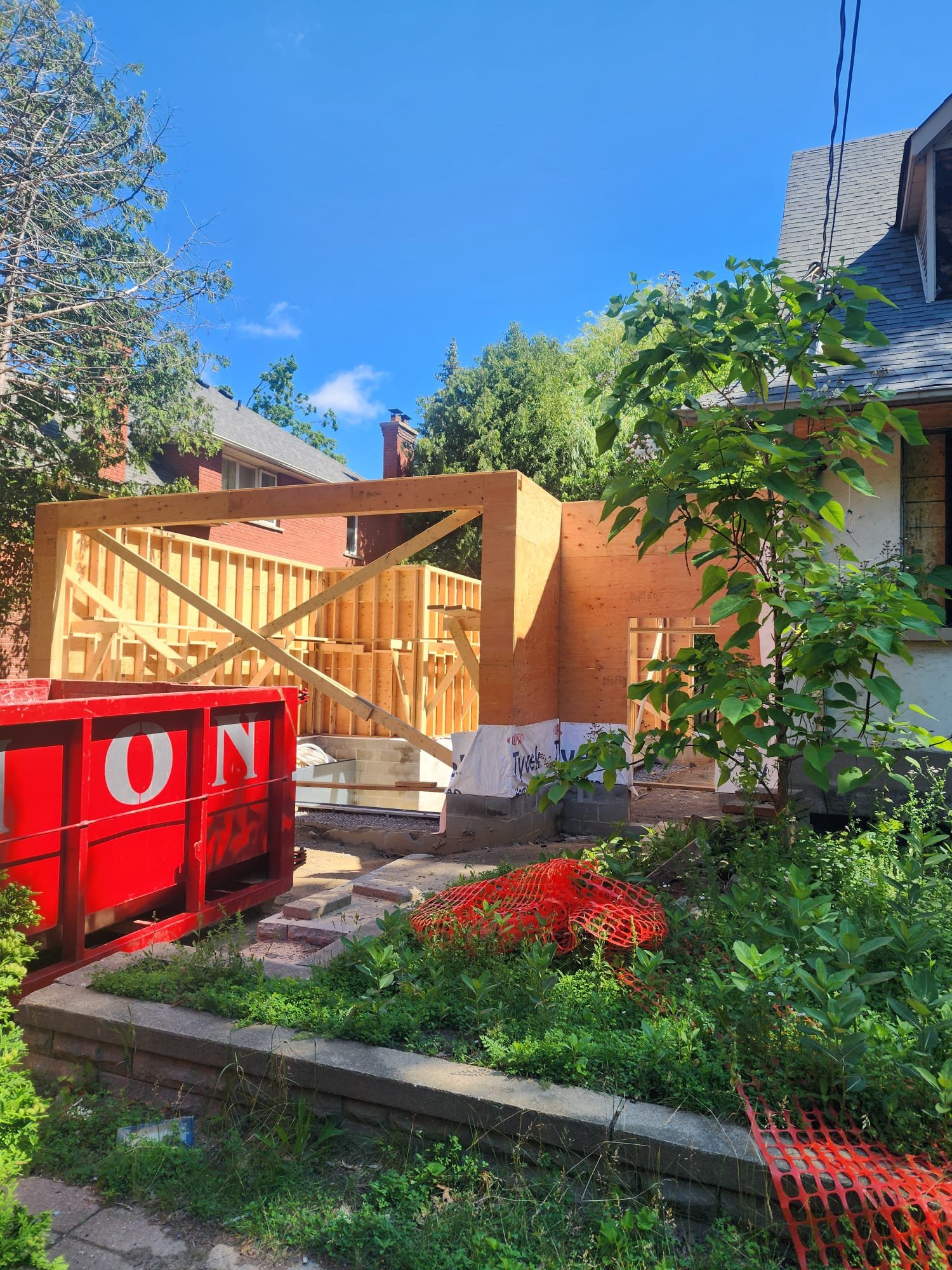 Backyard deck and landscape construction work at a residential property