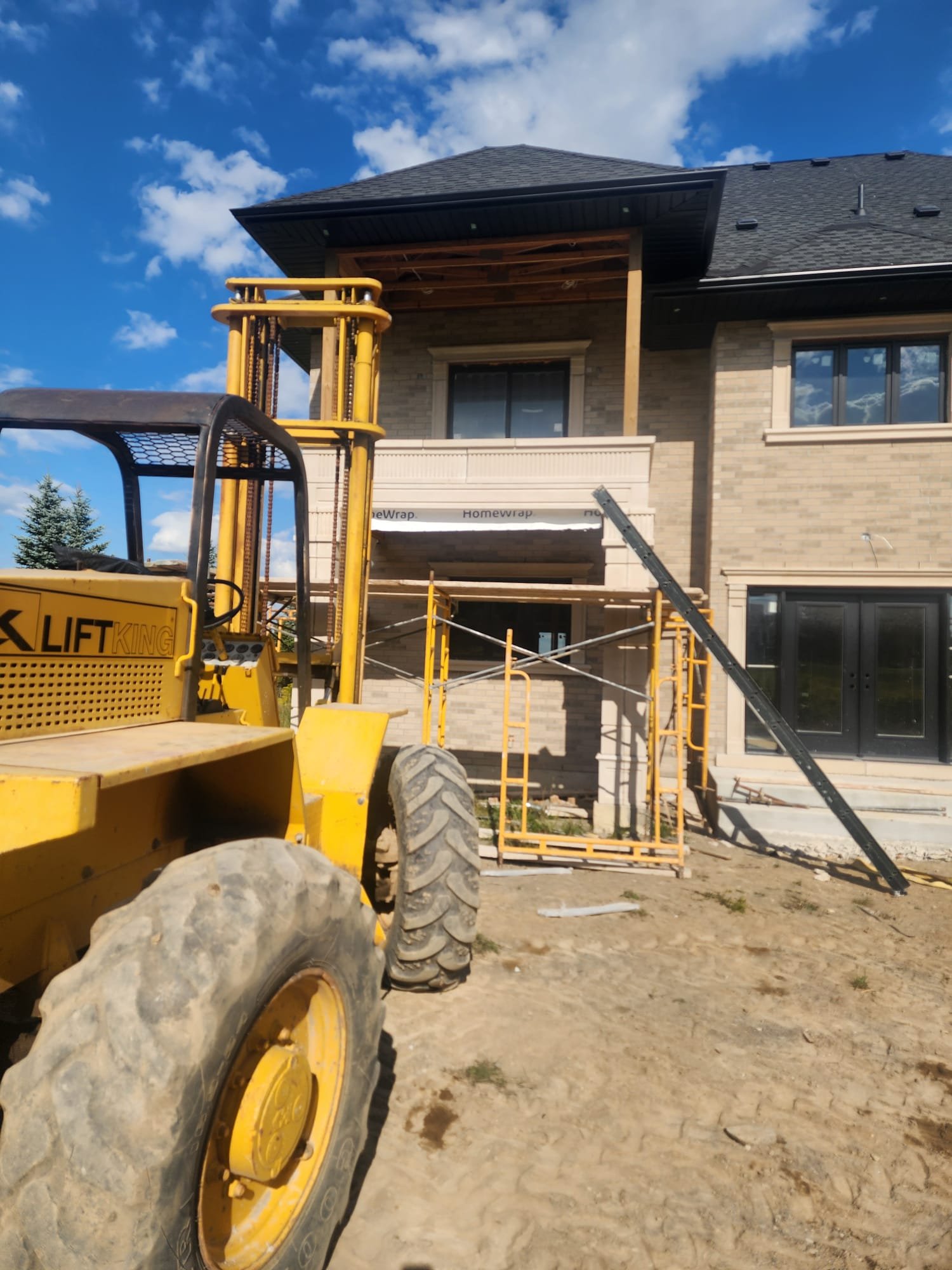 Rear home addition under construction with new structural framing