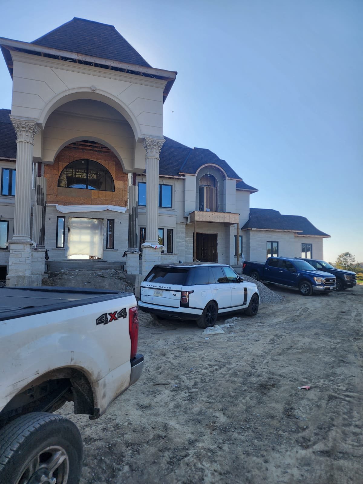 Large luxury home under active construction on site