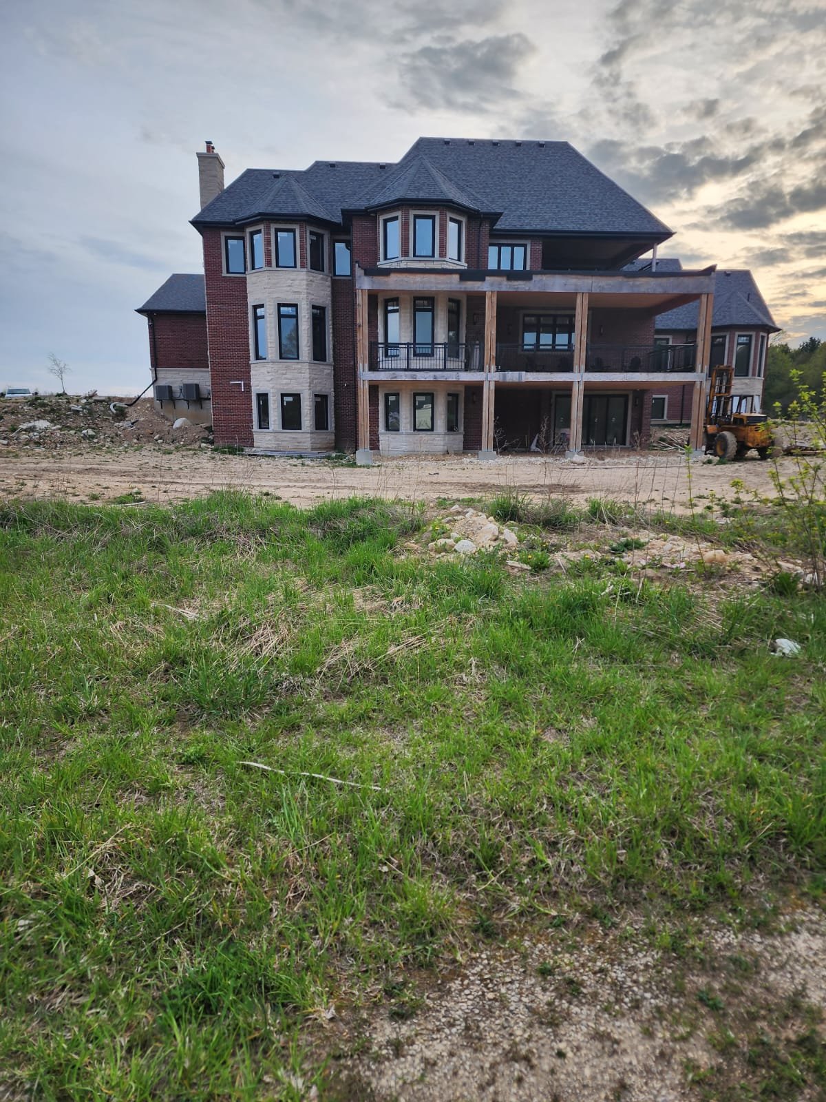 Rear elevation of a large estate home showing completed exterior design