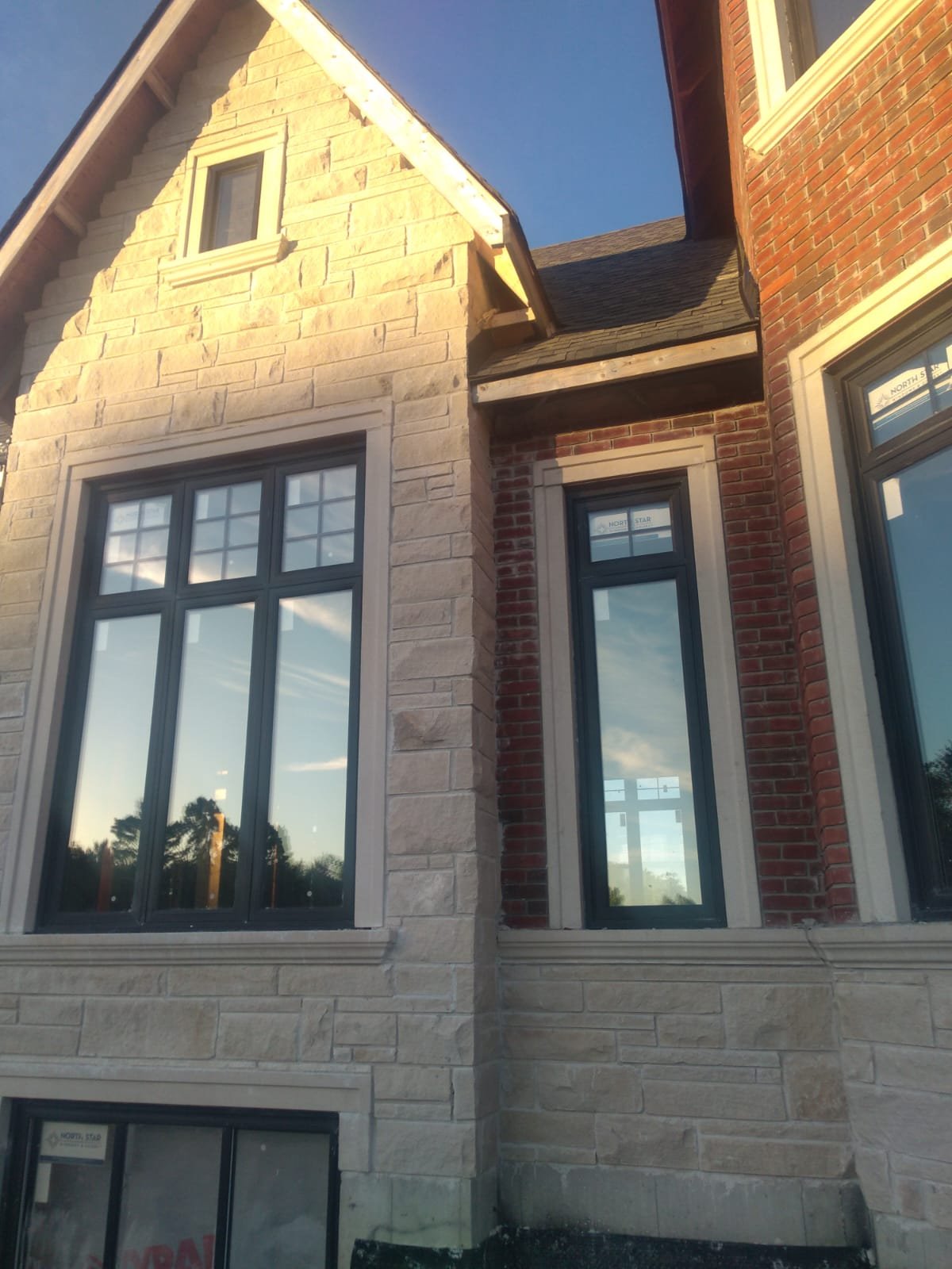 Finished stone and brick exterior with detailed window surround